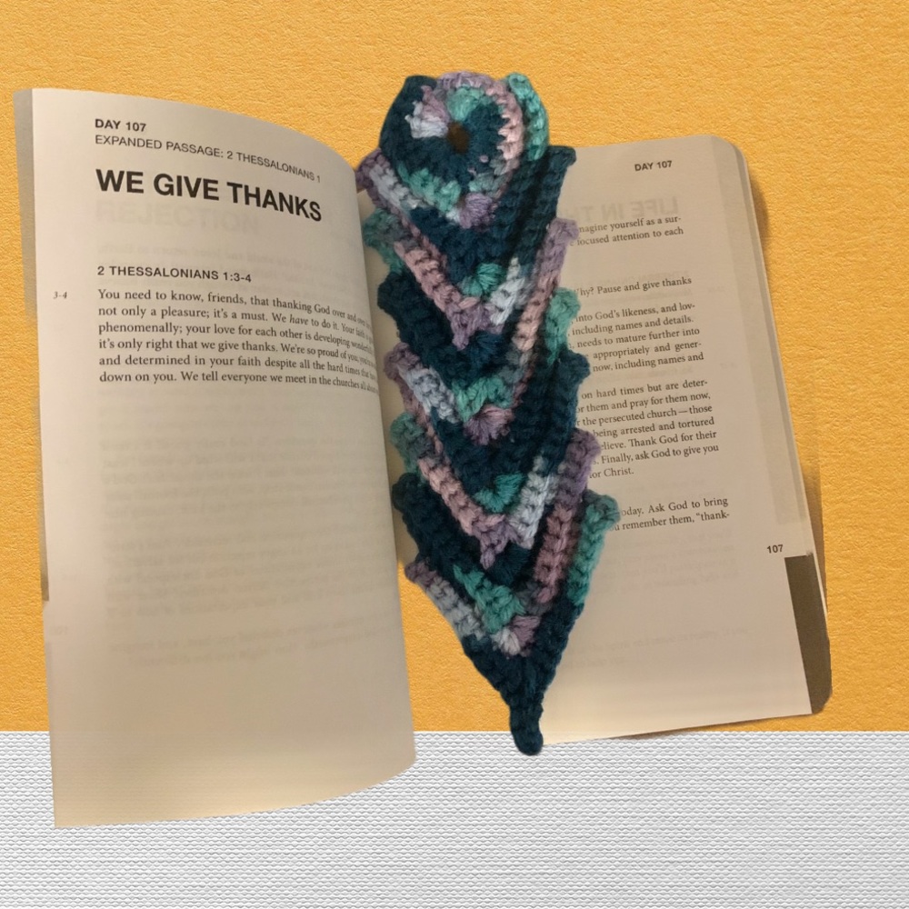 Handmade feather knitting for books.